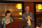 C12-5-29-Awards Chair Jo Anne Martinez presenting the Horticulture Sweepstakes Ribbon to Bill Price